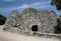 Le Village des Bories.  Primitive village comprising of mortarless stone  beehive shaped huts or bories each with a specific purpose.  Pictured is a wine cistern.European French Western Europe Agricu...