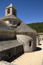 Abbaye Notre Dame de Senanque.  Exterior view of chapel and courtyard of twelth century Cistercian monastery.  Known as one of the Three Sisters of Provence together with the Romanesque and Silvacane...