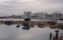 Hotels viewed from marina across beach and harbour.Beaches Middle East North Africa Resort Sand Sandy Seaside Shore Tourism African Northern