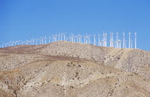 Wind powered generators on top of a mountainAmerican North America Northern TravelWindPoweredPowerGeneratorTurbineCaliforniaUnitedStatesOfAmericaAmericanUSAUSBlueSkyDesertConsumerTr...