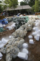 Tsunami. Dry ice blocks lay around the bodies to try and preserve them to ID  but with the huge number of deaths and nowhere to store them all quickly them have mostly been left out in the sun for sev...