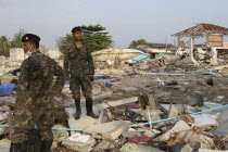 Tsunami. Thai Army soldiers who has been helping in the clean up at the devestated village caused by the tsunami also look for any bodies  nothing is left standing in the village. 2500 people are pres...