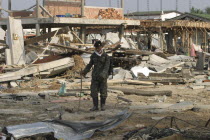 Tsunami. Thai Army soldiers who has been helping in the clean up at the devestated village caused by the tsunami also look for any bodies  nothing is left standing in the village. 2500 people are pres...