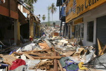 Tsunami. Phi Phi on the 11th day after the tsunami hit  Shattered shops and restaurants with 2 feet of debris covering what was once the walkway.On the 6th Jan.Asian Ecology Entorno Environmental En...