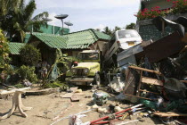 Tsunami carnage the day after. Two cars are left in the grounds of the Laonte Hotel. Patong is the busiest part of Phuket with hotels  bars  and shops in a very tightly condensed area  and being peak...