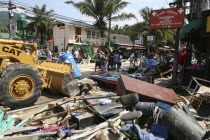 Tsunmai carnage the day after. The clean up starts from What is left of some shops and bars at Patong on the beach road. Patong is the busiest part of Phuket with hotels  bars  and shops in a very tig...