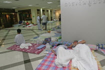 Tsunami carnage the day after. Foreign tourists in the Bangkok Phuket hospital  there are so many people that they do not have room and people are lane out where ever they can find space like the corr...