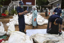 Tsunami. Australian forensic team. Volunteers try to cool off victims of Tsunami with dry ice blocks in the outdoor morgue where 100s of corpses are being stored without refridgeration   awaiting DNA...