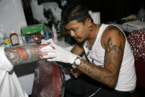 Tattooist at workAsian Southern Prathet Thai Raja Anachakra Thai Siam Southeast Asia