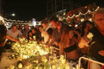 Tsunami. Thais and foreigners pay respect and have a vigil for the dead with candels and flowers in the heart of Patong on new years eve at midnight on the 31st Dec.Asian Ecology Entorno Environmenta...