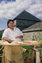 Ojibway Indian woman stripping the bark from treesOjibweOjibwa American Canadian Female Women Girl Lady North America Northern One individual Solo Lone Solitary 1 Female Woman Girl Lady Single unita...
