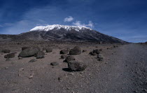 Snow capped Mount Kilimanjaro with large boulders of rock in the foregroundAfrican Eastern Africa Scenic Tanzanian