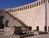 Fort interior with cannons and cannon balls placed by the wall.Middle East Omani