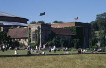 New theatre  exterior with audience members crossing the lawn in frontEuropean Great Britain Northern Europe Performance Theater UK United Kingdom British Isles Public Presentation