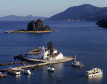 Mouse Island  view over white church on an island in a lakeEllada European Greek Krkira Religious Scenic Southern Europe