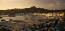 View of Mutrah area of Muscat including harbour and Mutrah Souk in the foreground.Market Middle East Omani