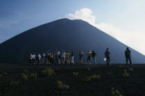 Crater view of the volcano with a line of people looking toward the summit.American Central America Hispanic Latin America Latino Scenic Southern