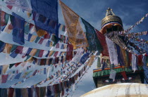 Stupa hung with prayer flags for Tibetan New Year celebrations.Bodhnath Asia Asian Bodnath Nepalese Religious
