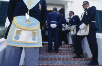 Cropped view of freemasons wearing regalia for the Peppercorn ceremony.Bermudian West Indies