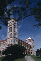 Sessions House Supreme Court building  exterior part framed by trees.Bermudian West Indies