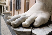The courtyard of the Palazzo dei Conservatori part of the Capitoline Museum with large marble feet from colossal ancient statuesEuropean Italia Italian Roma Southern Europe History Learning Lessons T...