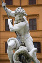 The central figure of the sea god Neptune fighting an octopus on the Fontana di Nettuno or Neptune Fountain in the Piazza NavonaEuropean Italia Italian Roma Southern Europe History Religion Religious