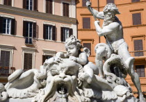 The Fountain of Neptune or Fontana del Nettuno in the Piazza Navona with the central figure of the sea god Neptune fighting an octopusEuropean Italia Italian Roma Southern Europe History Religion Rel...
