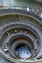 Vatican City Museum Tourists walking down the Spiral Ramp designed in 1932 by Giuseppe MomoEuropean Italia Italian Roma Southern Europe Catholic Principality Citta del Vaticano Gray History Holidayma...