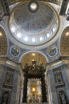 Vatican City The Dome of St Peters designed by Michelangelo above the gilded bronze canopy of the Baldacchino by Bernini with his Throne of St Peter in Glory beyondEuropean Italia Italian Roma Southe...