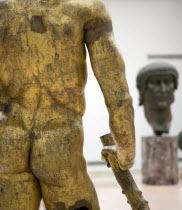 The Palazzo dei Conservatori part of the Capitoline Museum with the gilded bronze cult Statue of Hercules of The Forum Boarium in the foreground and the giant bronze head of Constantine beyondEuropea...