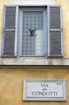 Road sign for the Via dei Condotti on the wall of the Louis Vuiton shop in the main shopping street in RomeEuropean Italia Italian Roma Southern Europe Store