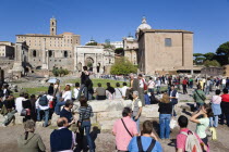 The Forum and tourists with from left to right the columns of the Temple of Saturn  the Palazzo Senatorio  the triumphal Arch of Septimius Severus and the CuriaEuropean Italia Italian Roma Southern E...