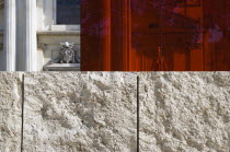 A red perspex cube part of a Valentino fashion exhibition behind a stone wall outside the Ara Pacis in front of the neo Classical church of San Rocco designed by Giuseppe ValadierEuropean Italia Ital...