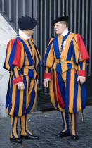 Vatican City Two Swiss Guards in full ceremonial uniform dress in conversationEuropean Italia Italian Roma Southern Europe 2 Catholic Principality Citta del Vaticano Gray Papal Religion Religious Chr...