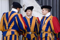 Vatican City Three Swiss Guards in full ceremonial uniform dress in conversationEuropean Italia Italian Roma Southern Europe 3 Catholic Principality Citta del Vaticano Papal Religious Christian Relig...