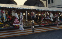 Puppets of New Year witch La Befana on street stall in Piazza del Erbes. La Befana is a character in Italian folklore who delivers presents to children at Epiphany.tradition culture European Kids Sou...