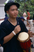 Portrait of drummer celebrating the lunar New Year.Louangphrabang Asian Kids Lao Luang Prabang Immature One individual Solo Lone Solitary Southeast Asia 1 Single unitary Southern Young Unripe Unripen...