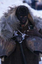 Reveller dressed as an Arapis during New Year carnival in village near Dhrama.Drama costume mask tradition culture Cultural Cultures Ellada European Greek Northern One individual Solo Lone Solitary S...