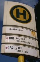 Bus and tram stop sign  green H within yellow circle stands for Haltestelle or stopping point.Deutschland European Western Europe