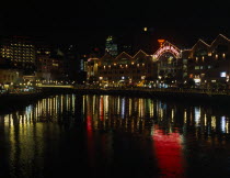 Clarke Quay on the Singapore River. Waterside shops and restaurants illuminated at night with multi coloured lights reflected on the water Asian Singaporean Singapura Southeast Asia Xinjiapo Colored...