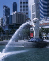 Merlion statue in Merlion Park with HSBC bank   The Fullerton Hotel and other city skyscrapers behindAsian Singaporean Singapura Southeast Asia Xinjiapo