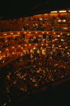 Interior of auditorium with attendees taking their seats before Opera performance.European Great Britain Northern Europe Performance UK United Kingdom British Isles Public Presentation