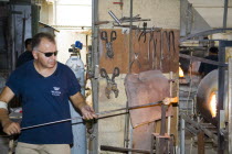 Glass blower manufacturing a glass ornament.TravelTourismHolidayVacationSightseeingTouristAttractionVallettaValettaValletaMaltaMalteseEuropeEuropeanUnionEUHorizontalIndoorIndoorsIn...