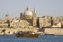 View of the capital city of Valletta from Sliema  and large yacht in foregroundTravelTourismHolidayVacationExploreRecreationLeisureSightseeingTouristAttractionTourDestinationTripJourney...