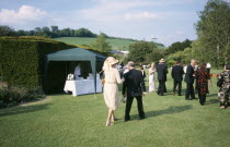 Opera attendees enjoying picnics in the gardens during Opera interval.Near LewesEuropean Great Britain Northern Europe Performance UK United Kingdom British Isles Public Presentation