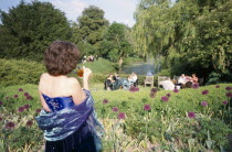 Opera attendees enjoying picnics in the gardens during interval.Near LewesEuropean Great Britain Northern Europe Performance UK United Kingdom British Isles Public Presentation