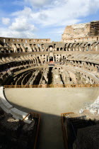 The Colosseum amphitheatre interior with tourists built by Emperor Vespasian in AD 80 in the grounds of Domus Aurea the home of Emperor Nero showing the restored sections in the foregroundEuropean It...