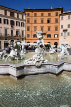 Piazza Navona The Fontana di Nettuno or Fountain of Neptune with the central figure of the sea god Neptune fighting an octopusEuropean Italia Italian Roma Southern Europe History Holidaymakers Religi...