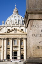 Vatican City The Basilica of St Peter with tourists at the entrance and a detail of the base of the Obelisk in the foregroundEuropean Italia Italian Roma Southern Europe Catholic Principality Citta d...