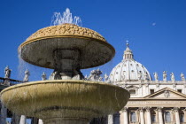 Vatican City The Basilica of St Peter and the square or Piazza San Pietro with a water fountain in the foregroundEuropean Italia Italian Roma Southern Europe Catholic Principality Citta del Vaticano...